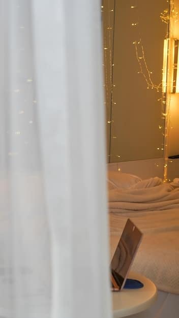 A cozy bedroom setup with soft lighting, blackout curtains, a comfortable bed, and calming decor, exemplifying a sleep-conducive environment.