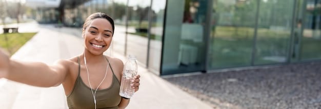 A person drinking water after a workout, emphasizing hydration and recovery. The focus is on a refreshing and healthy image.
