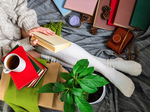 An image depicting various self-care activities, like reading in a cozy spot, taking a relaxing bath with bubbles, enjoying a cup of tea, and practicing yoga. The atmosphere is calm and inviting, with soft lighting and comfortable settings.