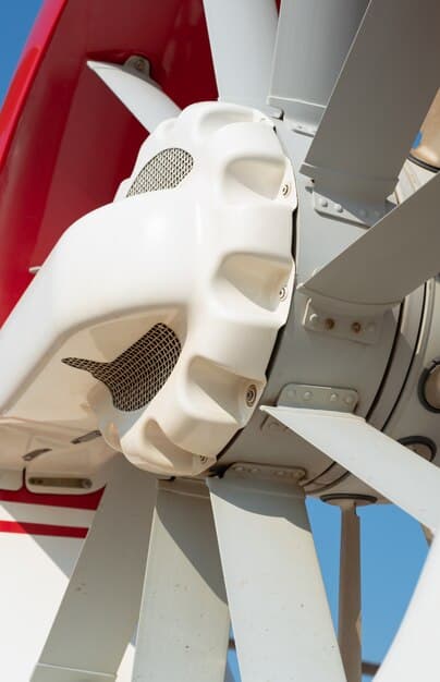 A close-up shot of a cutting-edge wind turbine blade being manufactured in a high-tech facility. Sparks fly as robotic arms weld components together with precision. Engineers in lab coats monitor the process, emphasizing the technological innovation in wind energy production.