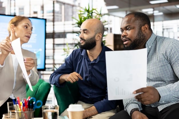 A diverse group of business professionals in a meeting room, brainstorming strategies to combat inflation. They are looking at charts and graphs displaying financial data, with laptops and tablets scattered around the table, symbolizing collaboration and data-driven decision-making.